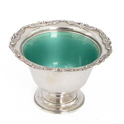 American silver pedestal bowl, of circular goblet form, with fluted embossed foliate rim a...