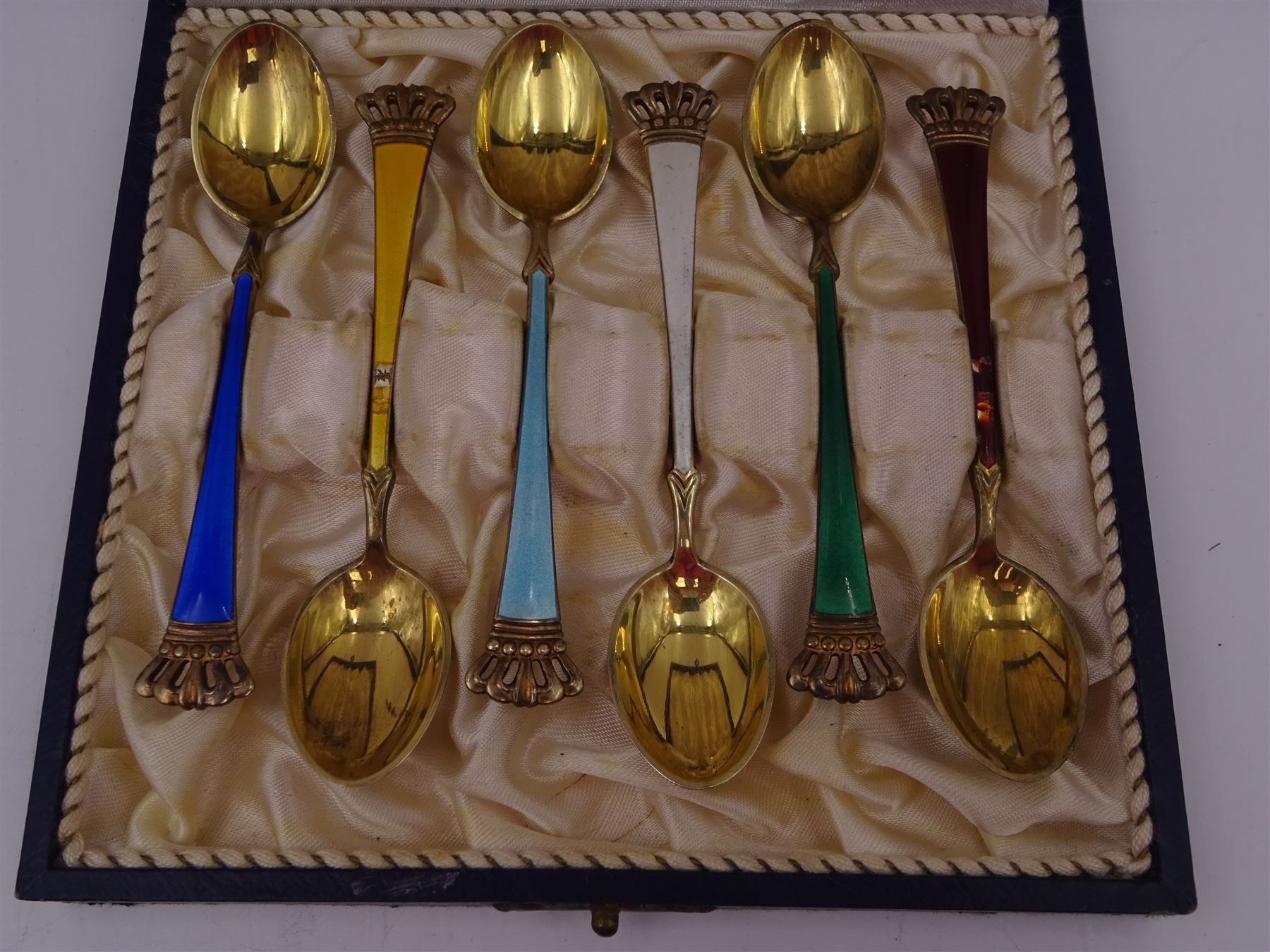 Set of six Danish silver-gilt harlequin enamel demitasse spoons with crown finials, by Egon Lauridsen, stamped ELA Denmark Sterling 925S, in fitted case