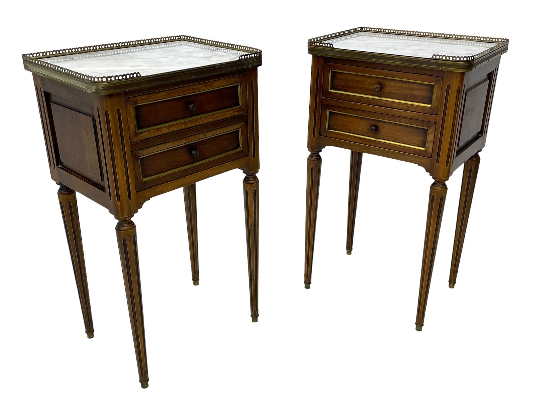 Pair of French design mahogany and marble bedside lamp tables, rectangular white marble top with raised brass gallery, fitted with two drawers, sunken facias with applied brass edging, panelled sides, on turned and fluted tapering supports 