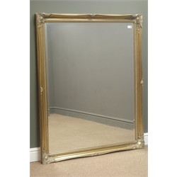  Rectangular bevel edge wall mirror in swept gilt frame, W105cm, H131cm  
