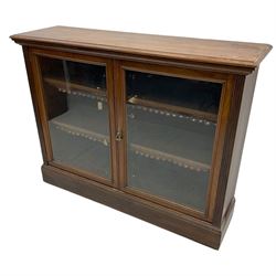 Phillips & Sons Ltd Bristol - Victorian mahogany glazed bookcase, projecting moulded cornice over two glazed doors, enclosing two shelves with scalloped edging, raised on a plinth base