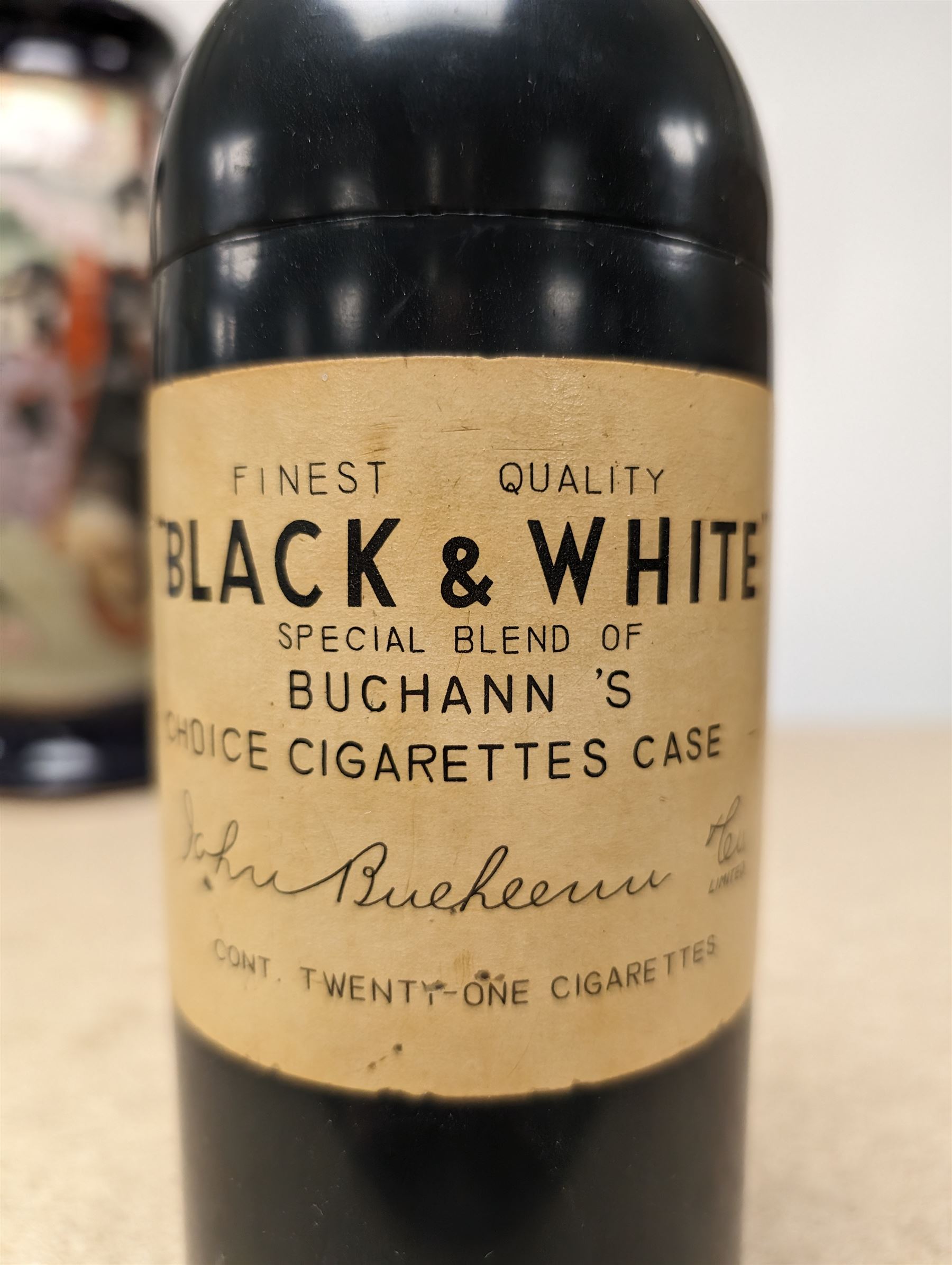 Novelty musical cigarette dispenser, in the form of a Black & White whisky bottle, H28cm