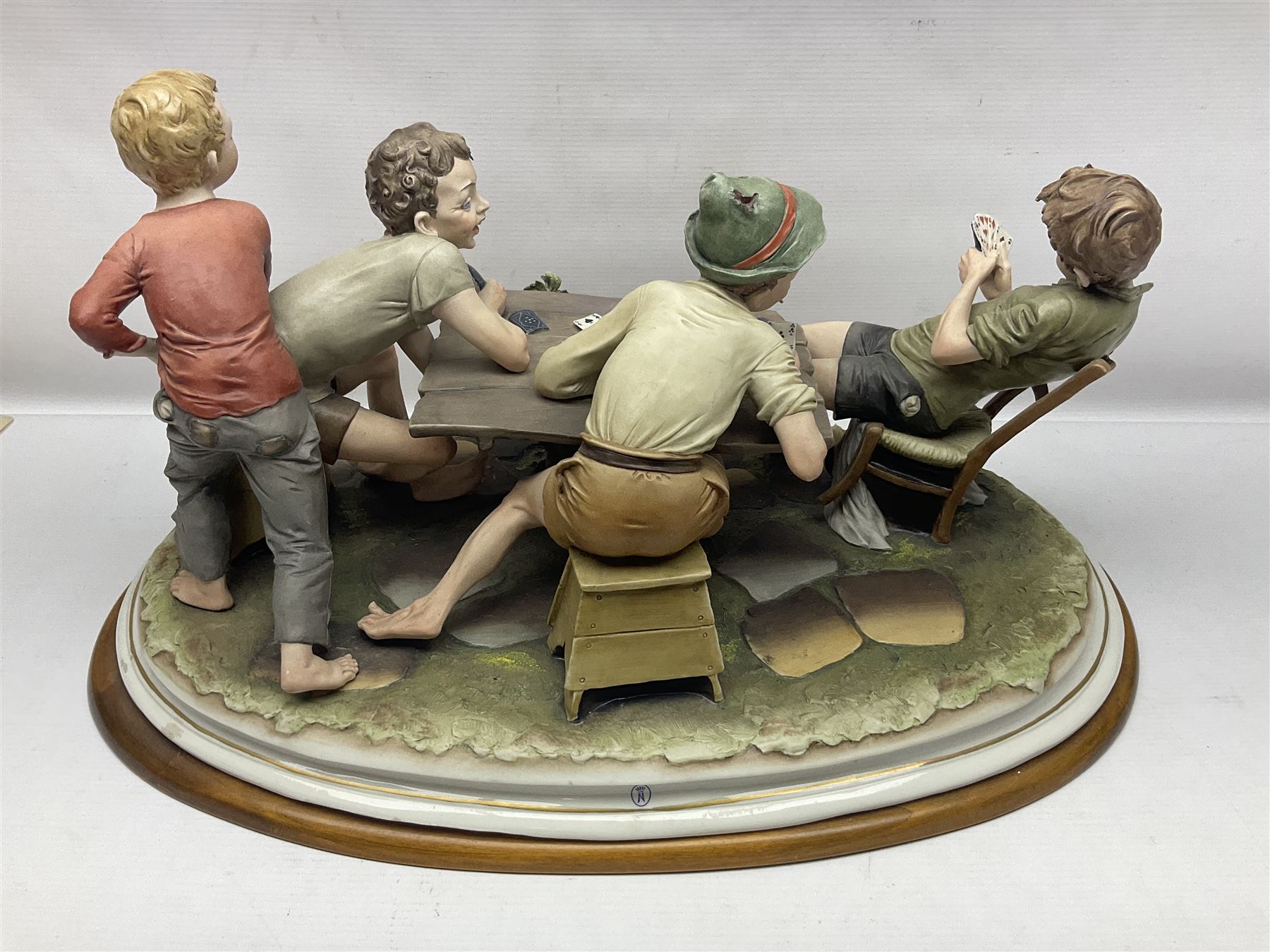 Capo Di Monte group The Cheats, modelled as boys playing cards, with certificate, H27cm 