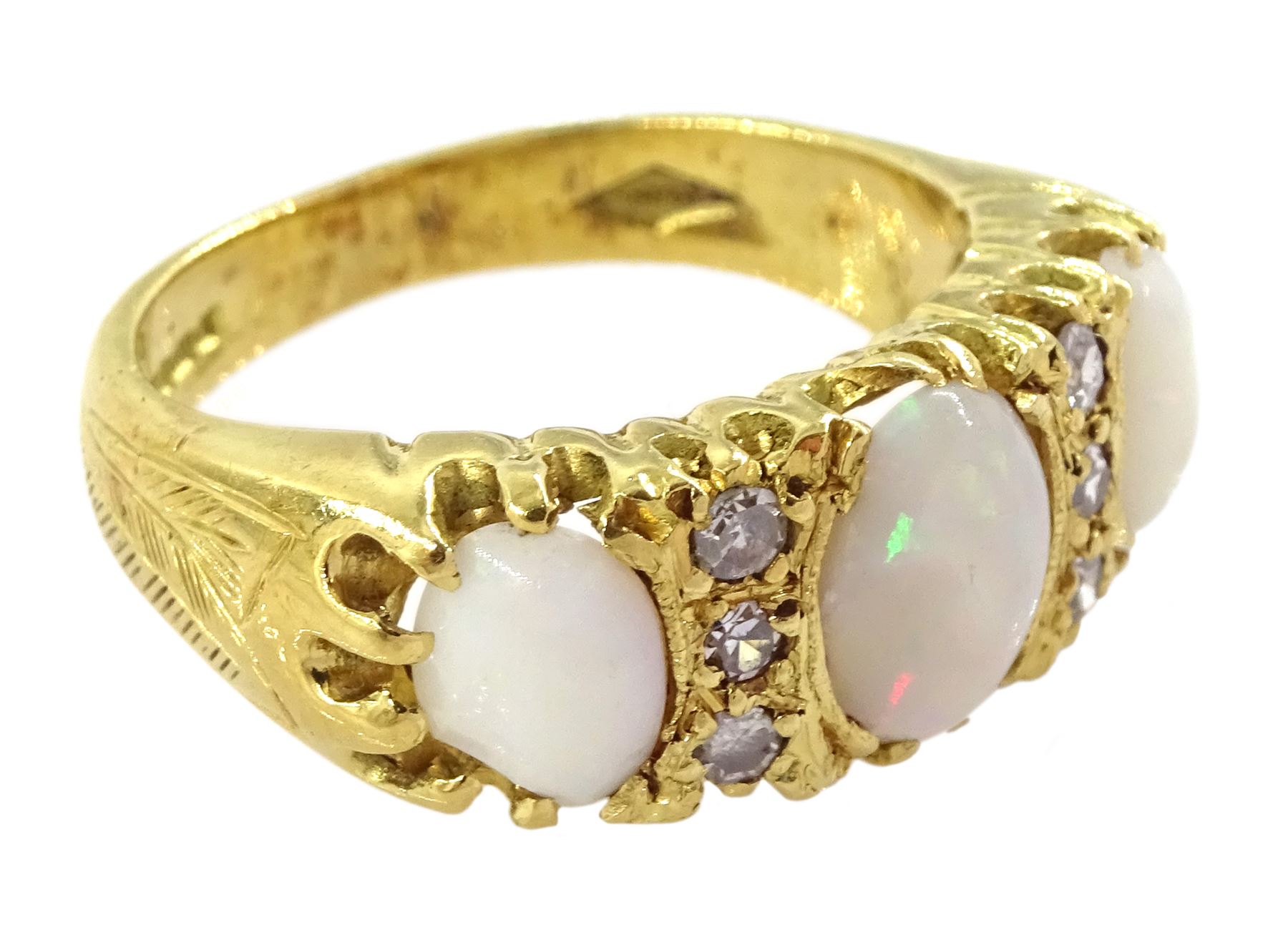 18ct gold three stone opal and six stone diamond ring, London 1966