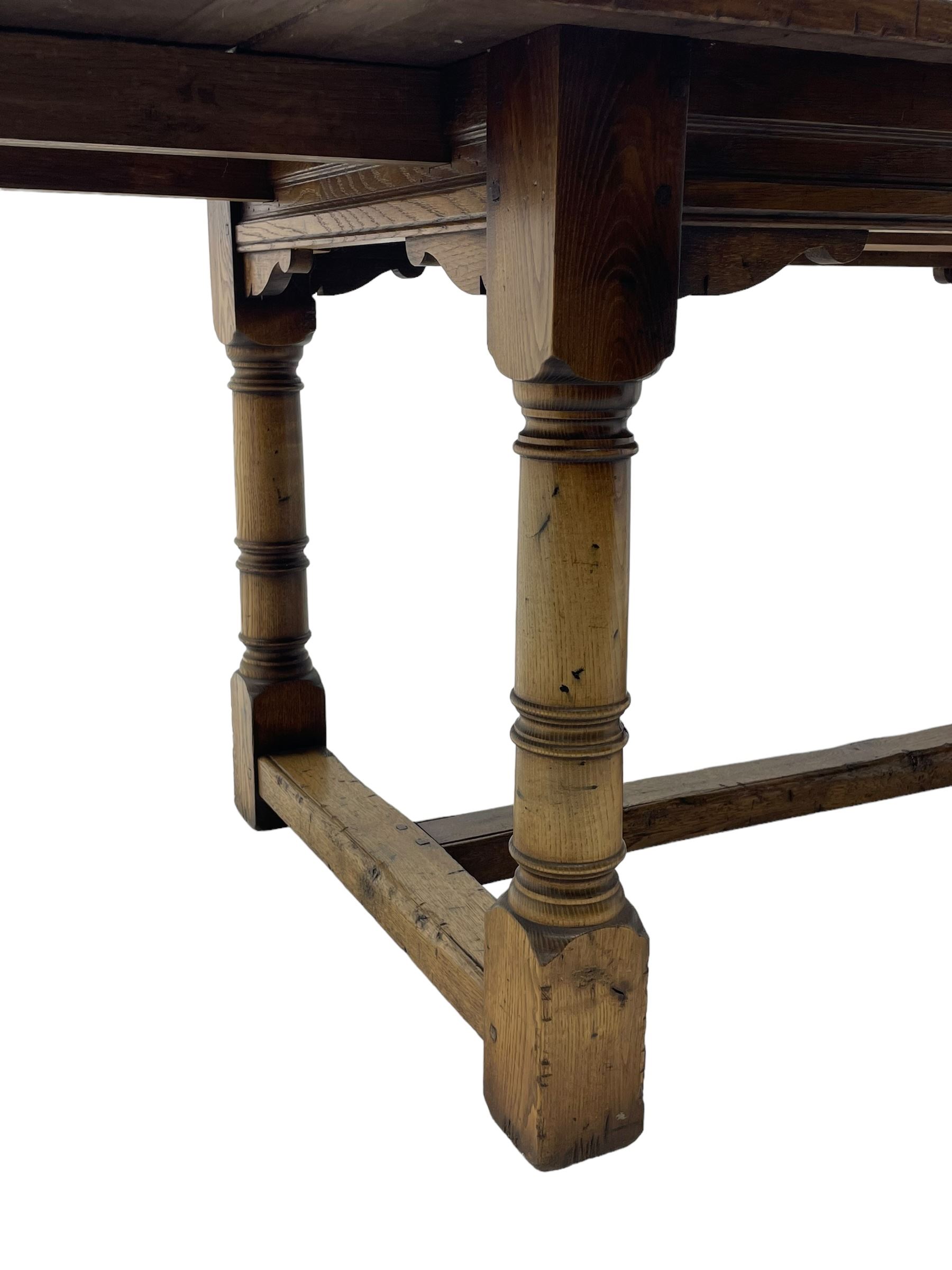 Oak refectory dining table, rectangular three plank top with cleated ends, two additional leaves, on turned supports united by H-stretchers 