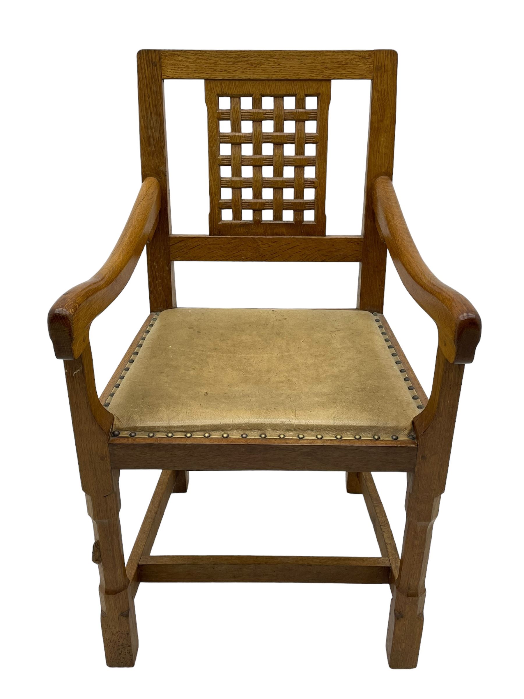 Rabbitman - set of six (5+1) oak dining chairs, pierced and carved lattice back, leather upholstered seat with stud band, on octagonal supports united by stretchers, carved with rabbit signature, by Peter Heap of Wetwang 