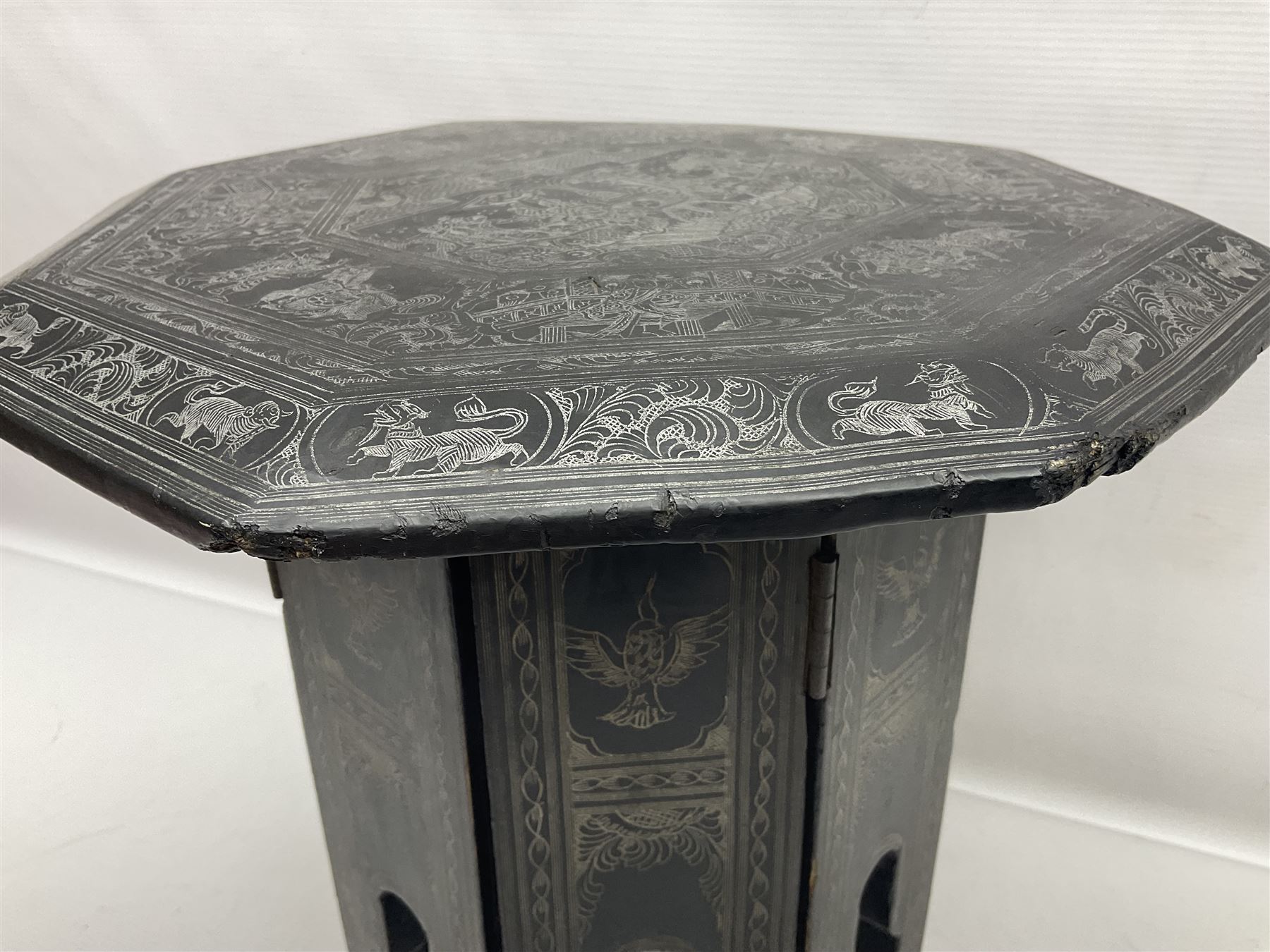 Anglo-Indian octagonal occasional table, with silvered inlay and a central panel depicting a temple scene, H36cm 