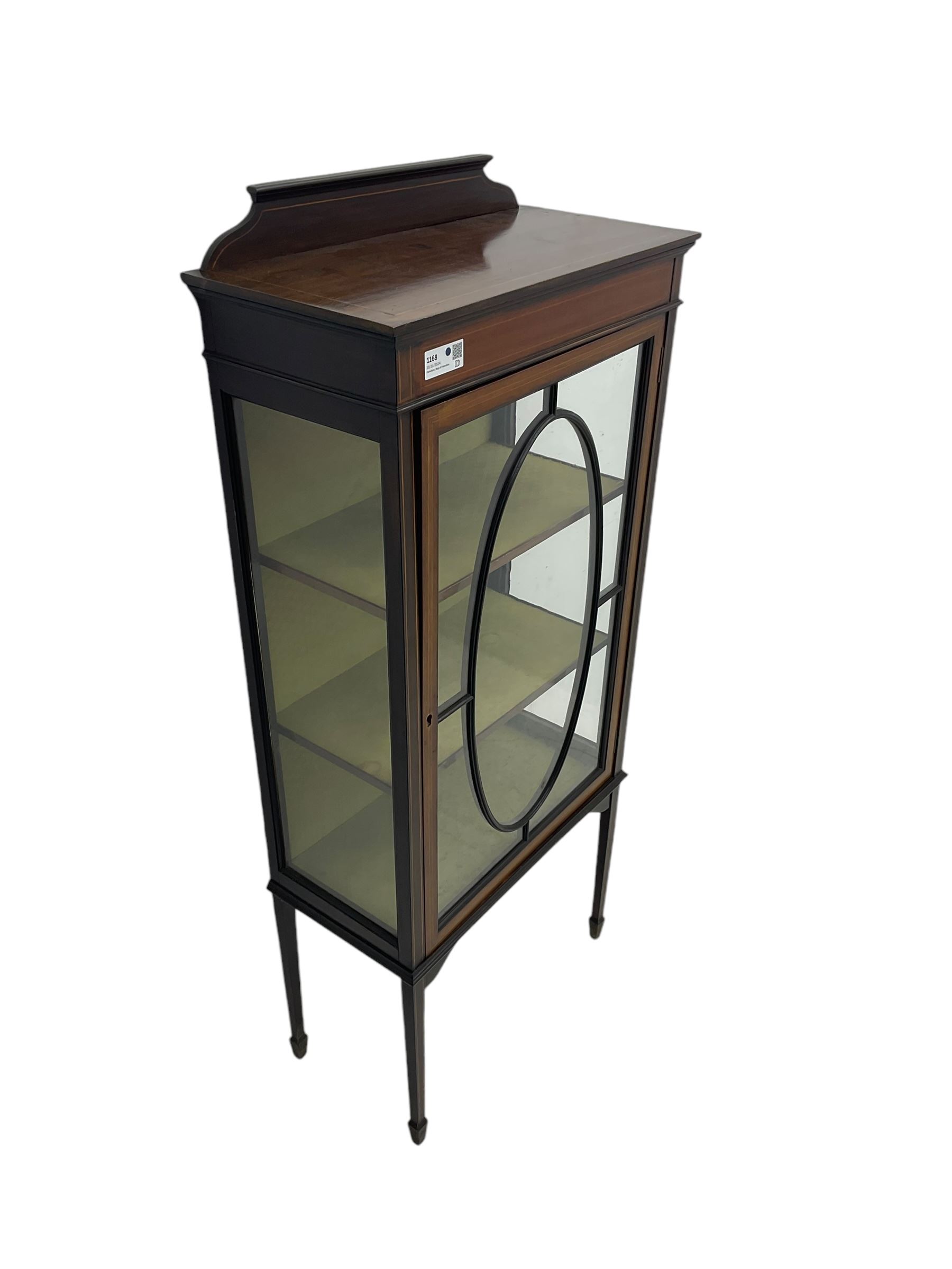 Edwardian inlaid mahogany display cabinet, shaped and raised back over single astragal glazed door, interior lined and fitted with two shelves, raised on square tapering supports