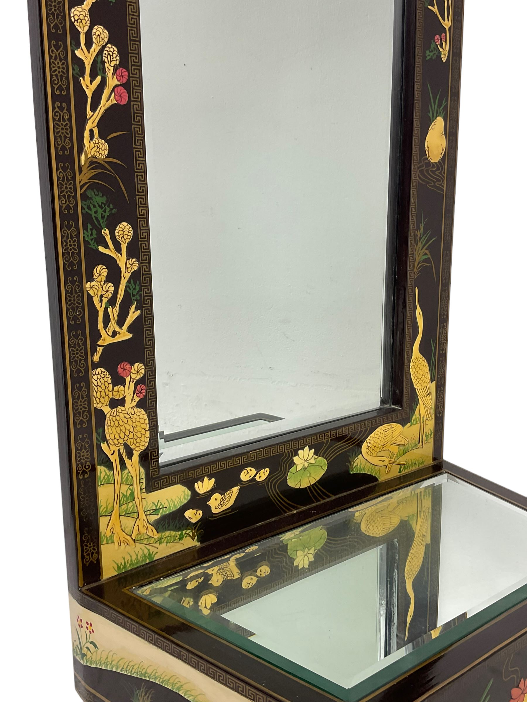 Chinoiserie design wall hanging mirror with shelf, the rectangular frame with raised decoration depicting birds and landscapes, fitted with bevelled glass 