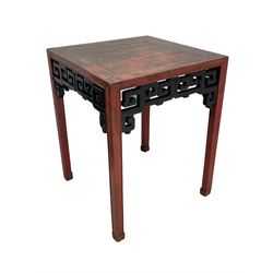 Late 19th century Chinese Qing dynasty red and black lacquered wood tall tea table, Shanxi region, square top over geometric scroll fretwork panels, on square supports with hoof feet 