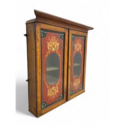 Late 19th century oak cabinet, projecting cornice over twin doors inset with painted glass...