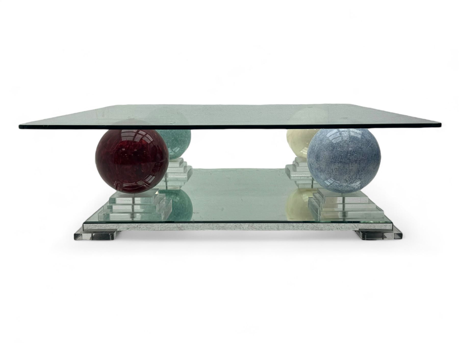 Barker & Stonehouse - contemporary glass coffee table, square top supported by four multicoloured marble spheres, each elevated on layered acrylic pedestal over mirrored base, on square clear supports