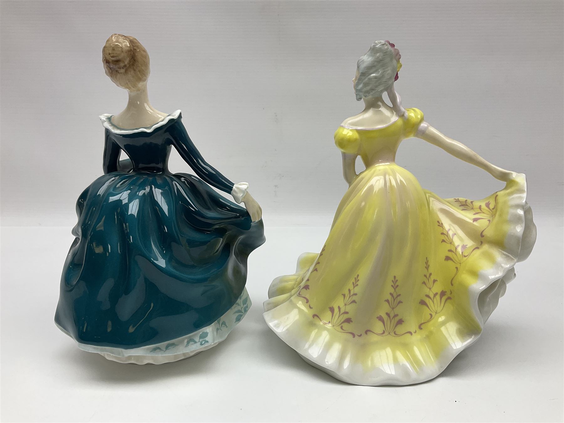 Five Royal Doulton figures, comprising Ninette HN2379, Adrienne HN2304, Top o the Hill HN1934, Janine HN2461, Southern Belle HN2229