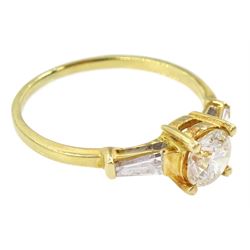 18ct gold single stone round brilliant cut diamond ring, with tapered baguette diamond shoulders, stamped 750, principal diamond approx 0.65 carat, total diamond weight approx 0.85 carat