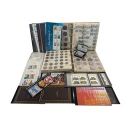 Coins and stamps including Queen Elizabeth II mint stamps in presentation packs and bookle...