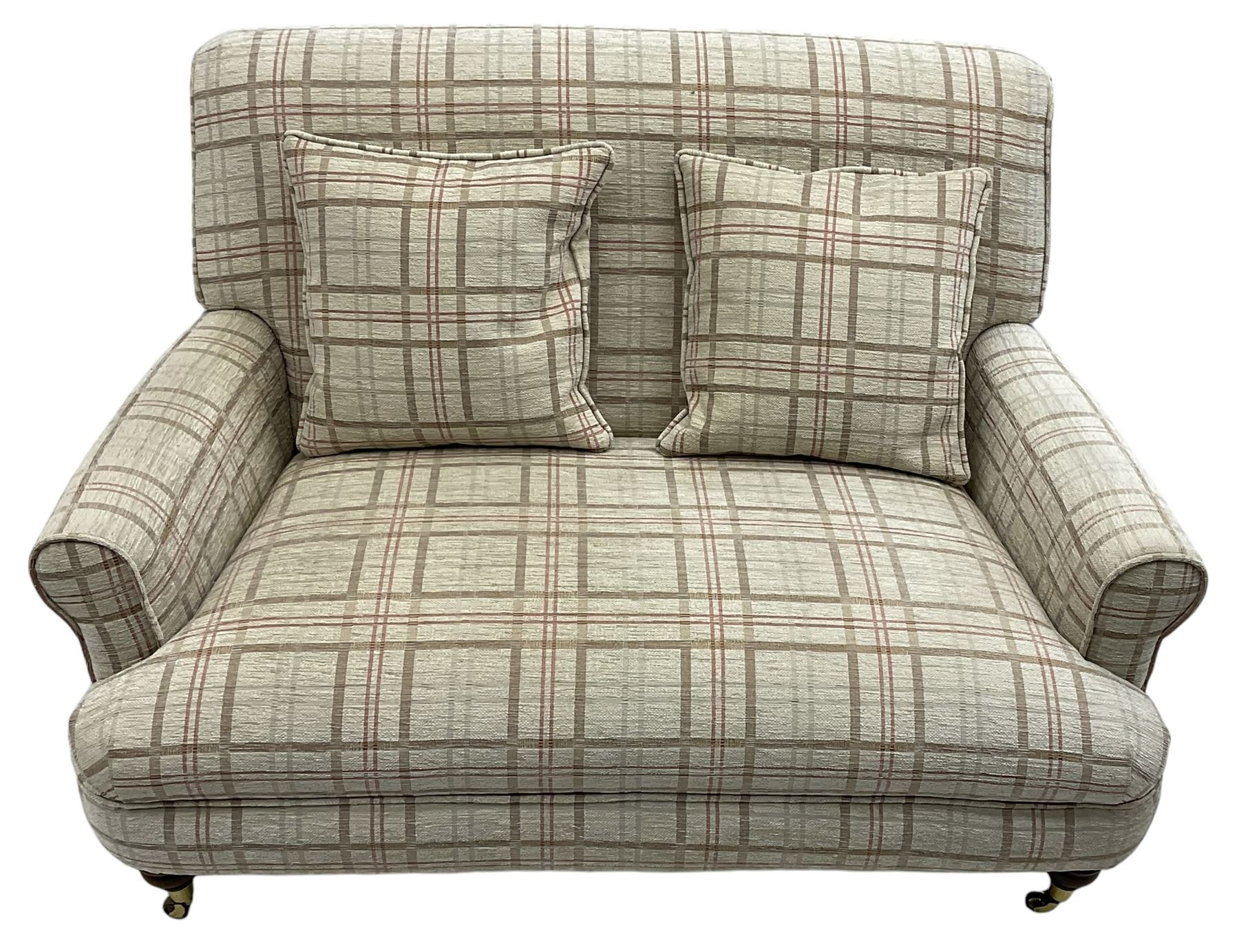 Traditionally shaped two-seat sofa, rolled back and arms, upholstered in checkered fabric, on turned front supports with brass cups and castors 