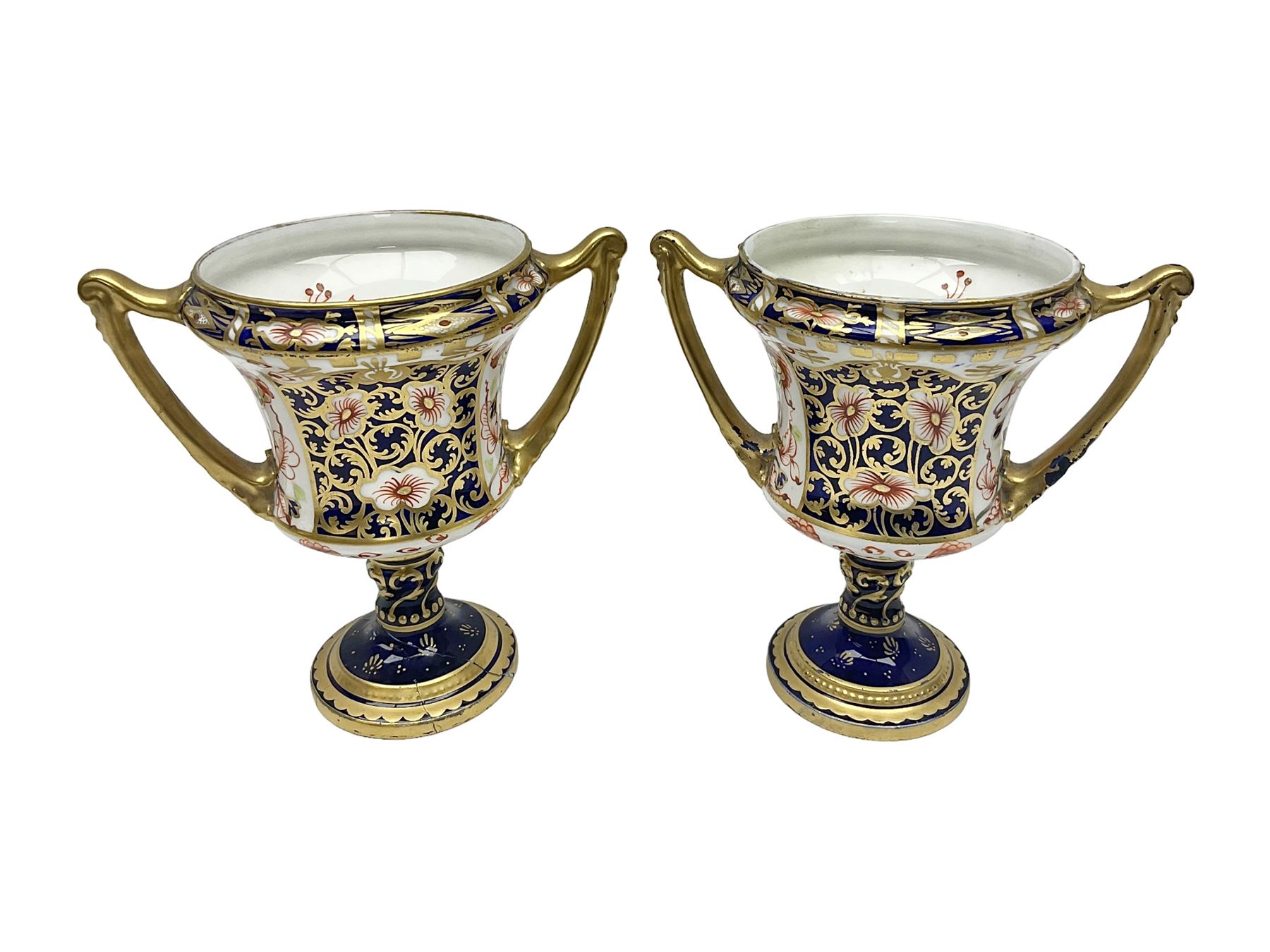 Pair of Royal Crown Derby 6299 Imari pattern twin handled trophy vases, of wasted cylindrical form, with printed mark beneath, H13cm 