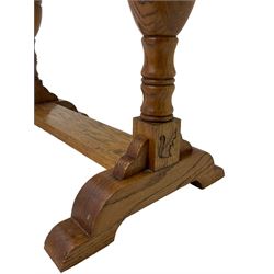 20th century oak occasional table, rectangular top on turned twin pillar supports, carved with squirrel motif, on shaped sledge feet united by stretcher 