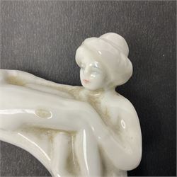 Late 19th/early 20th century Japanese erotica white glazed porcelain walking stick handle, modelled as two geishas, W10cm