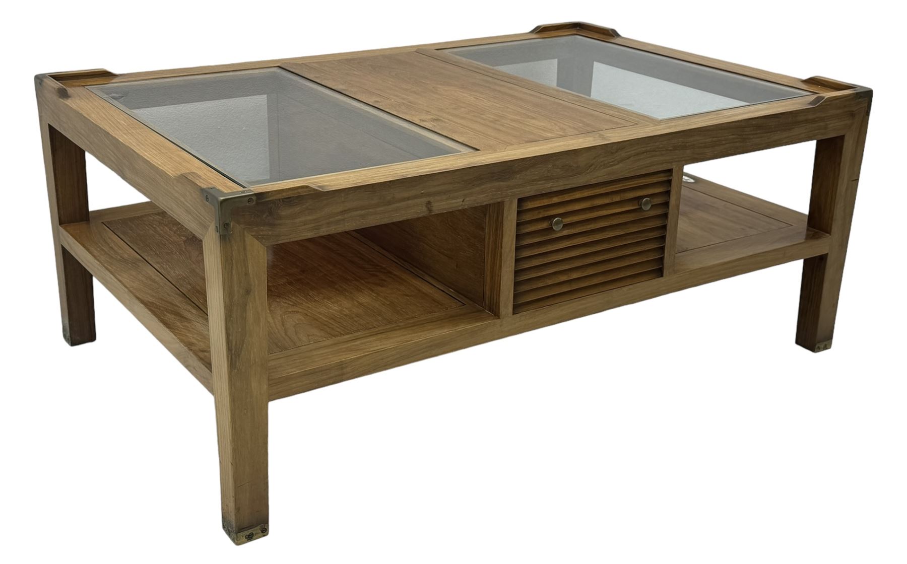 Starbay Tobago cherry wood coffee table, rectangular top with two inset glass panels, central drawer with louvred front and brass handles, flanked by open shelving, raised on square supports with metal corner brackets