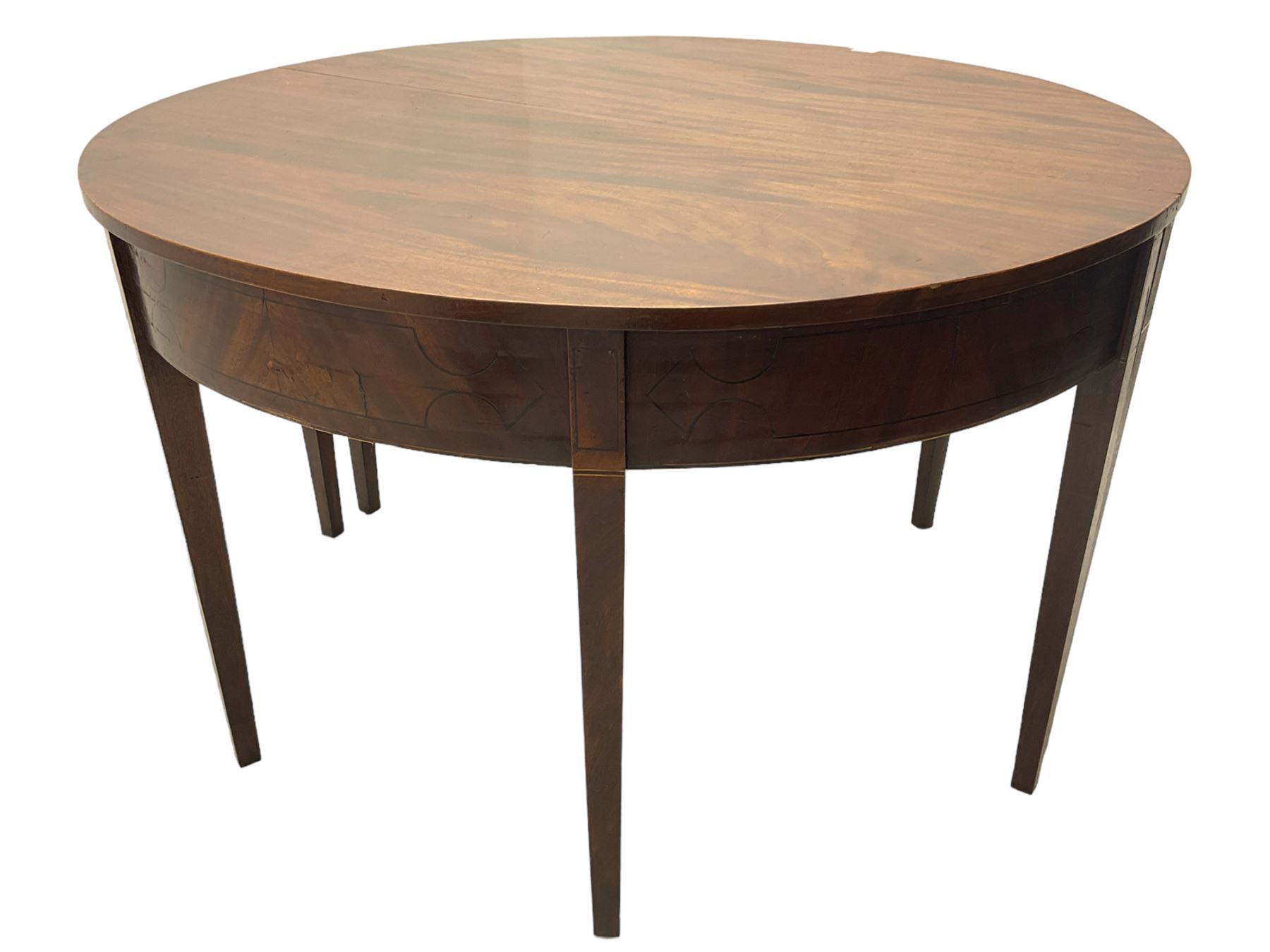 Regency mahogany D-ended extending dining table, circular top with banded fireze inlaid with ebony stringing, raised on square tapering supports, with two additional leaves, supported by gate-leg central action