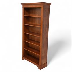 Yew wood open bookcase, moulded and dentil cornice over five adjustable shelves, fluted up...