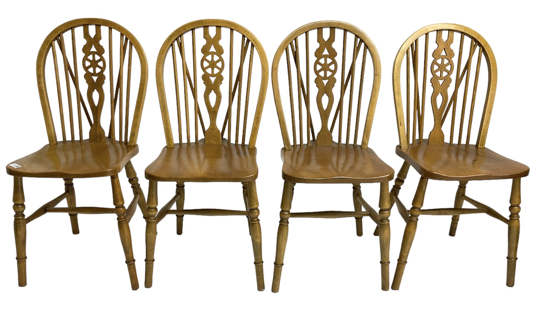 Set of four elm and beech wheelback dining chairs