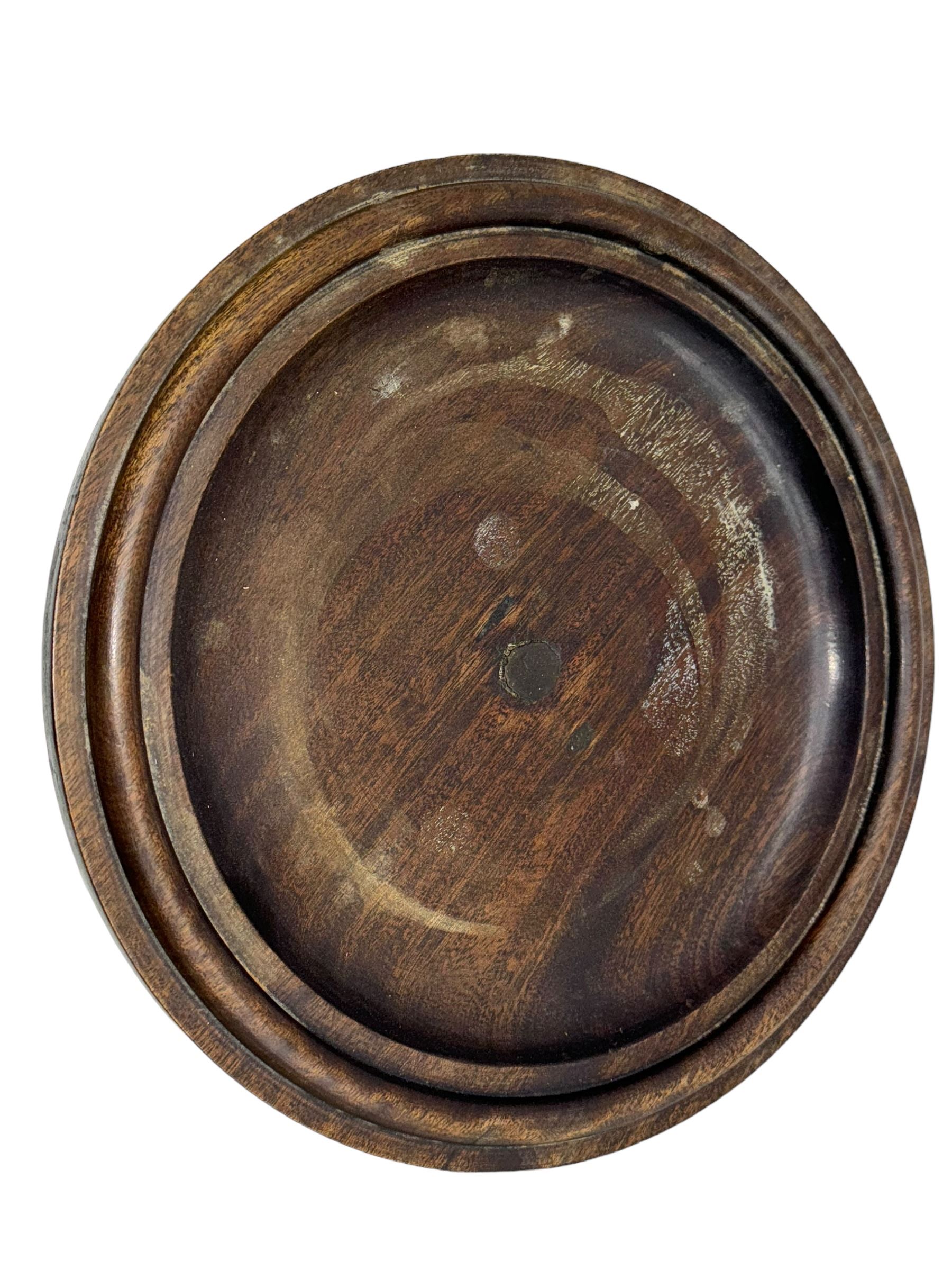 Late 19th century mahogany plant stand or torchère, circular top over barley twist column and carved acanthus base, on square plinth with bracket supports