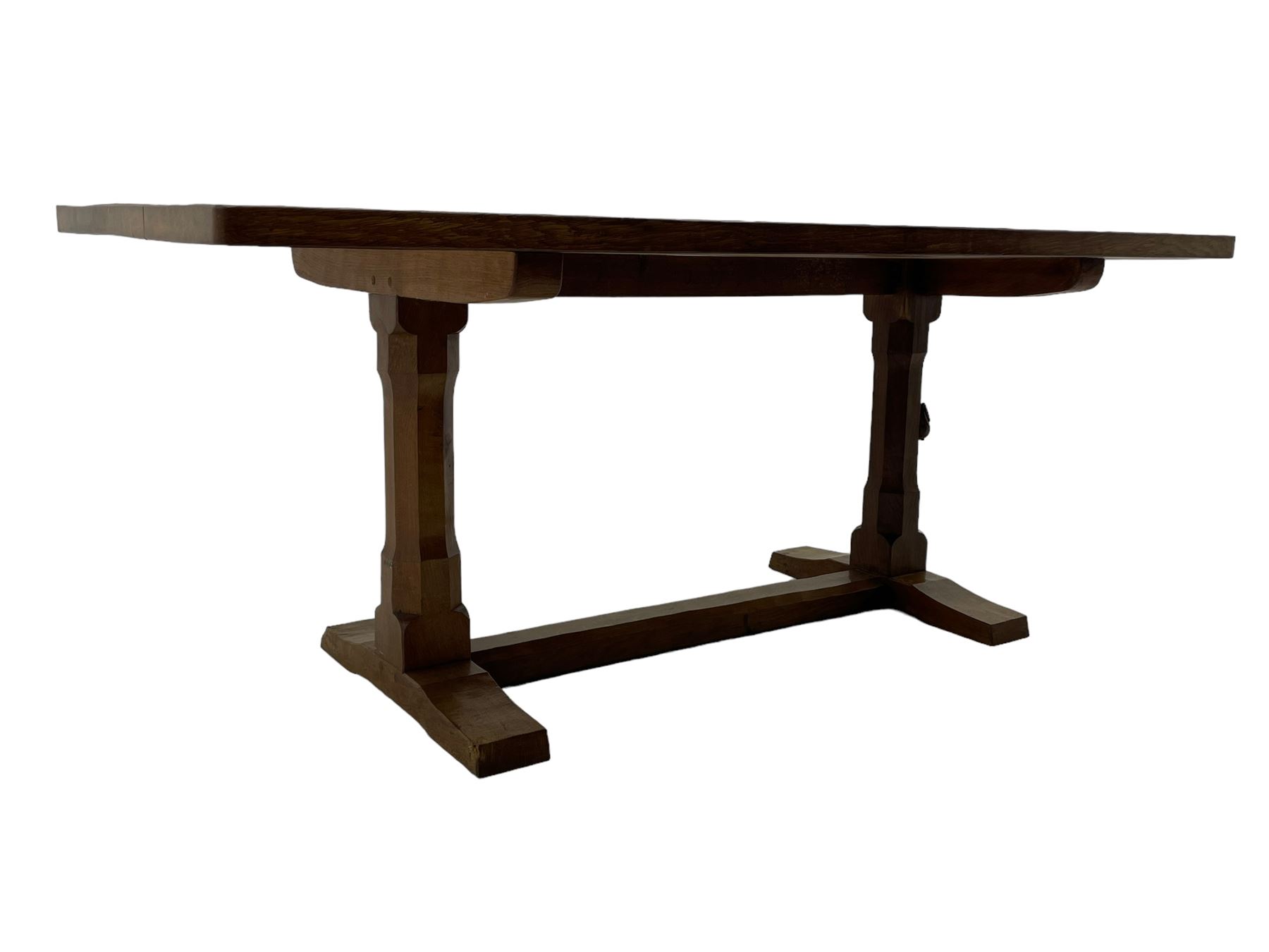 Rabbitman - oak dining table, rectangular adzed top, twin octagonal pillar supports on sledge feet, united by floor stretcher, carved with rabbit signature, by Peter Heap of Wetwang 