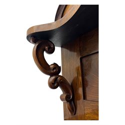 Mid-19th century rosewood chiffonier, raised back with scroll and leaf carved shaped pediment, serpentine top over drawer and double cupboard with scrollwork decoration, on shaped plinth base