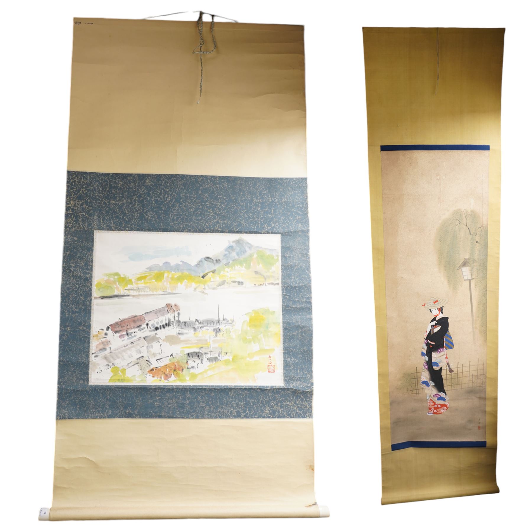 Japanese School (Meiji Period): Geisha Holding a Shamisen under a Lamppost, watercolour on silk signed and stamped, with scroll backing and box 127cm x 40cm; together with another similar of a landscape scene (2)