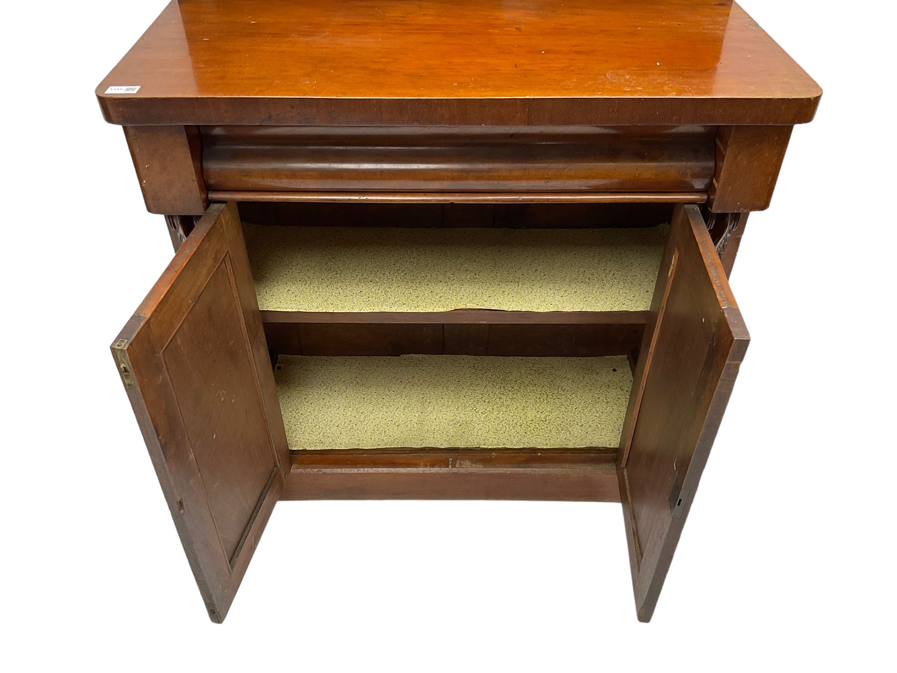 Victorian mahogany chiffonier, raised back with carved C-scroll foliage mounts and shelf, rectangular top with rounded corners over frieze drawer and double panelled cupboard, on skirted base