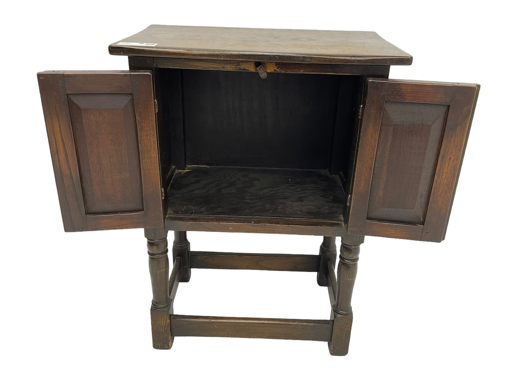 Small oak hutch cupboard, fitted with two carved doors