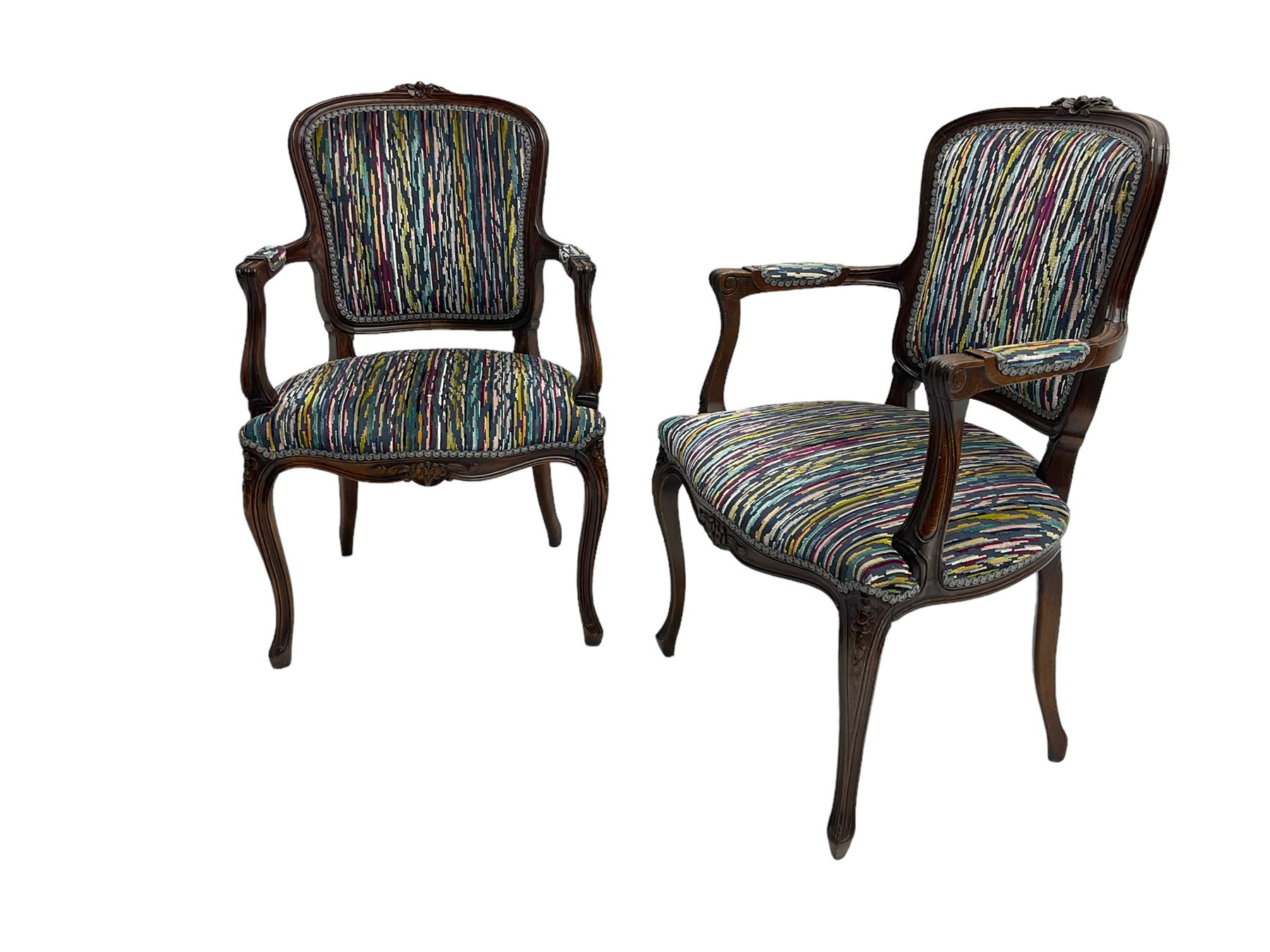 Pair of French design open armchairs, the moulded frame carved with flower heads, upholstered seat, back and arms, on cabriole supports