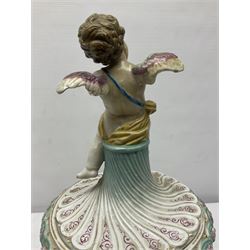 Early 20th century continental pedestal jar with cover, the bowl held aloft by four mermaids and decorated with putti playing instruments in a lake, the fluted domed cover topped with cherub playing a horn, H38cm