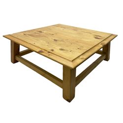 Pine coffee table, moulded top square top raised on splayed supports united by box stretchers 