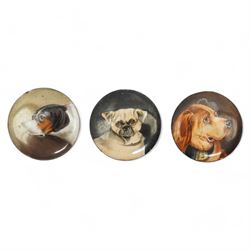 Three unmounted 19th century circular enamel discs, each painted with a portrait of a dog, comprising a Bloodhound after Sir Edwin Landseer, a Pug and a Terrier, all unsigned, D2.2cm (3)