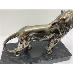 Silvered metal lion, upon a rectangular base, H12cm