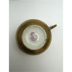 Early 20th century Royal Worcester cup and saucer decorated by Thomas Lockyer, the interior of the cup and the saucer decorated with fruit to a mossy background, with puce printed mark beneath 