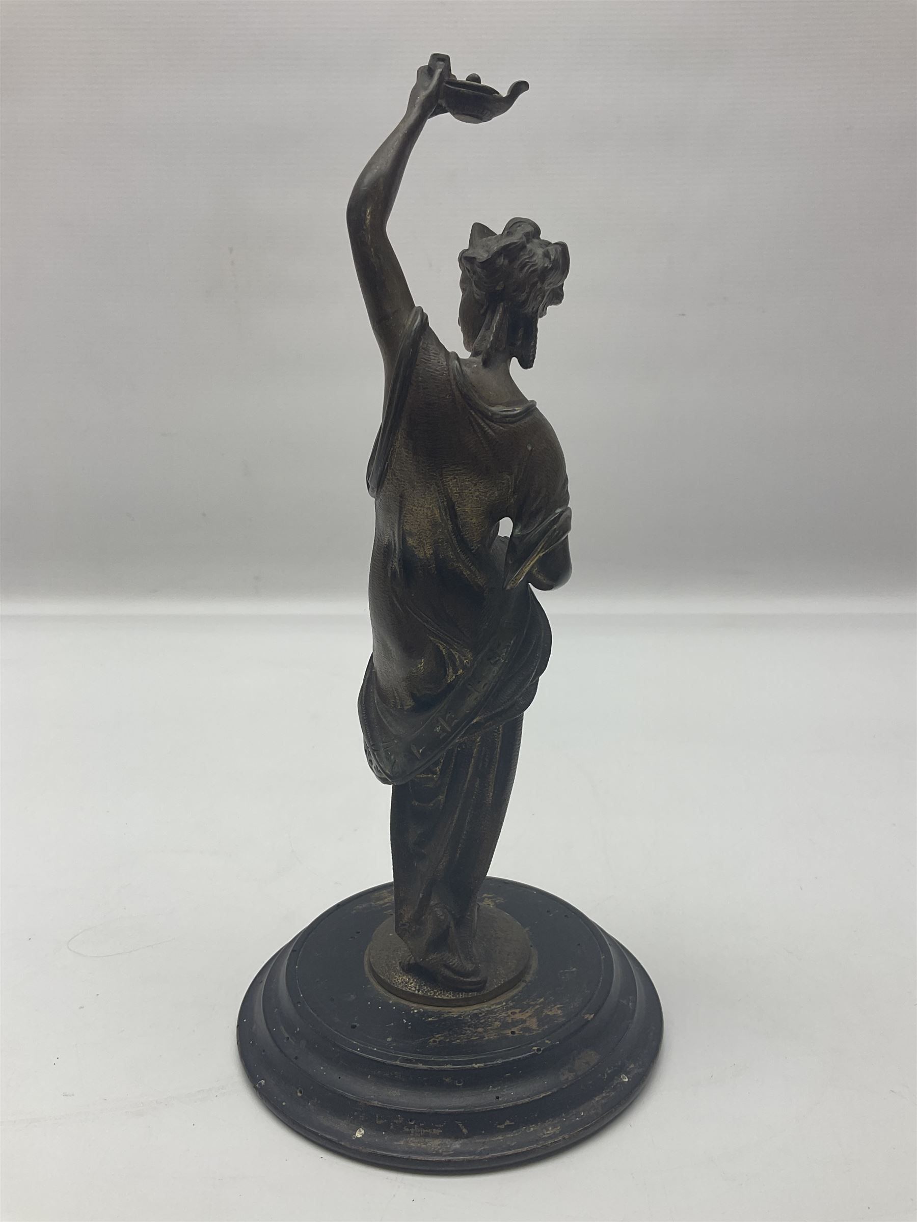 Gilt bronze figure of a lady in neo-classical dress, on a circular wooden plinth, H26cm