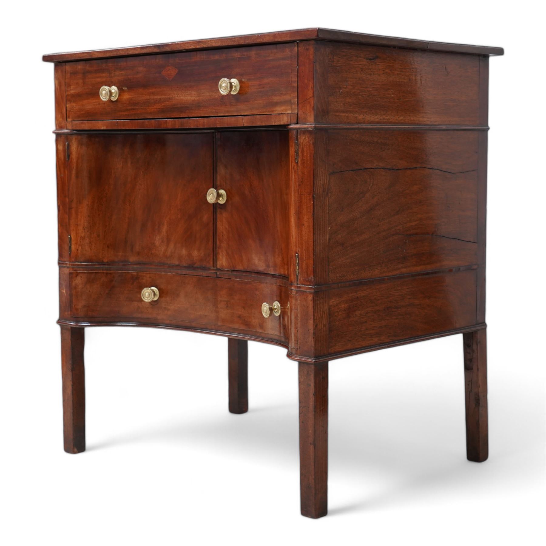 George III mahogany concave side cabinet, rectangular protruding top over a single drawer, the recessed concave body fitted with a double cupboard and single drawer, lower moulded edge on square supports