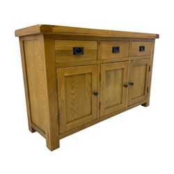 Contemporary light oak sideboard, fitted with three drawers over three panelled cupboards enclosing shelving, on square supports