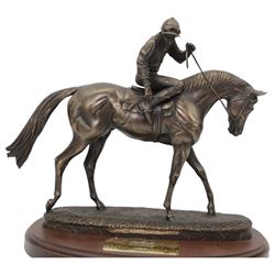 'Southwell, Winner 1995' - bronzed resin trophy by David Geenty of a racehorse with jockey up on oval wooden base, signed 30cm x 32cm 