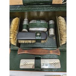 Gentleman's vanity set, containing ebony brushes, chrome jars and bottles, within fitted leather carrycase, together with two other similar brushes 