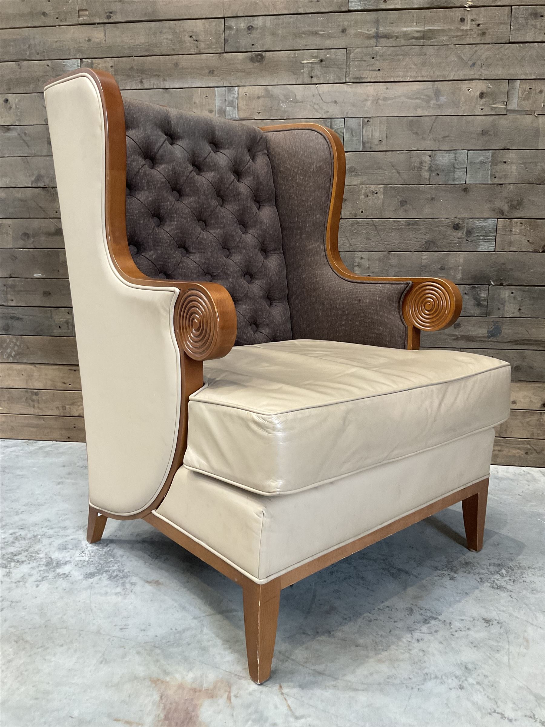 Walnut finish framed wing back armchair upholstered leather and buttoned fabric