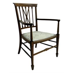 Edwardian inlaid mahogany armchair, curved top rail above spindle backrest with central X-shaped splat, the arms supported by turned uprights, over upholstered padded seat in pale blue damask fabric, on tapered supports with spade feet