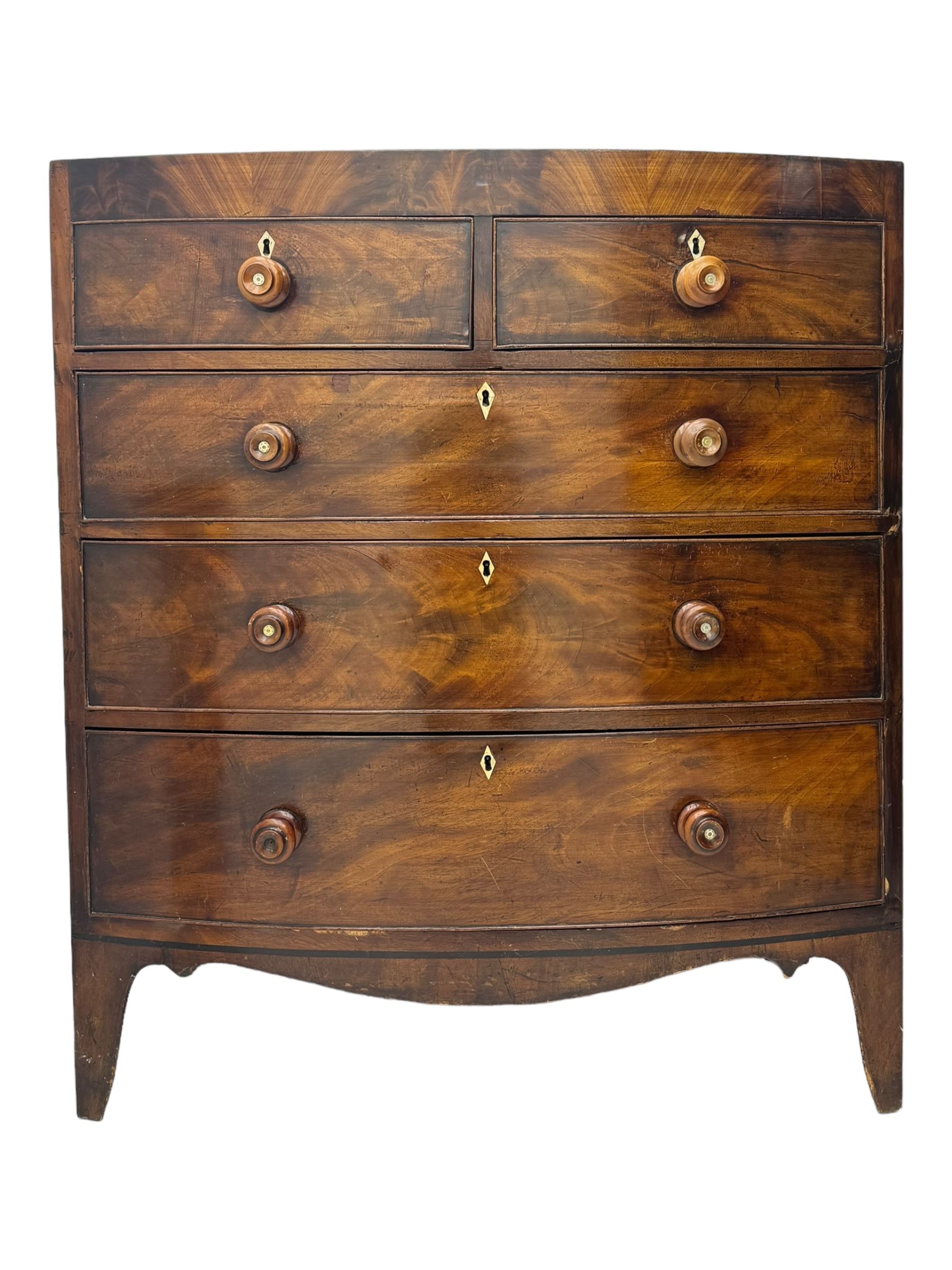 Early 19th century mahogany bow-front chest, fitted with two short over three long graduated cockbeaded drawers, each with turned wooden knobs and bone escutcheon, raised on splayed bracket supports