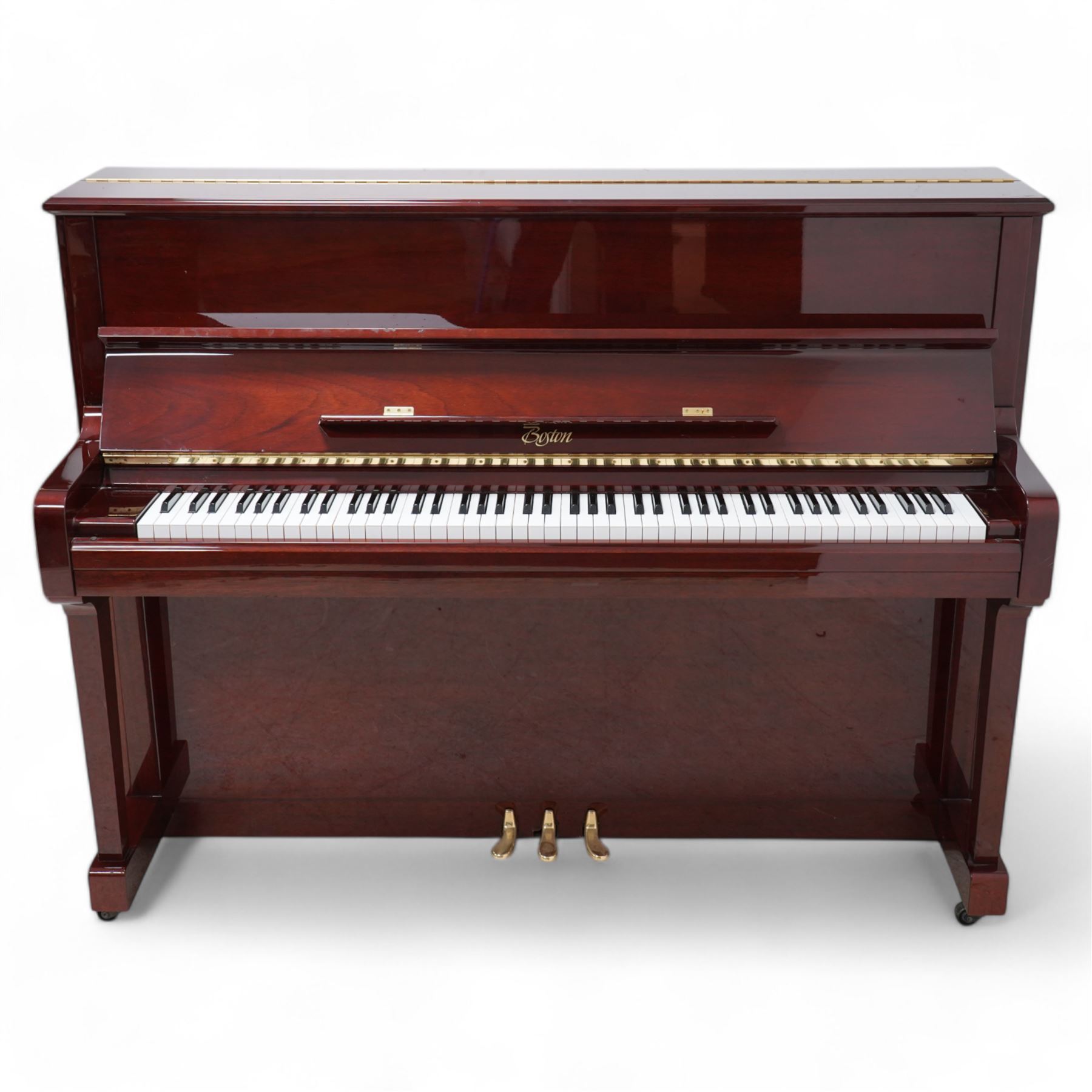 Boston - Upright overstrung piano in a lacquered mahogany case, designed by Steinway and manufactured by Kawai in Japan, Model 118E, serial No 131623 (1999), with 88 synthetic ivory/ ebony keys (seven octaves) with mute, una-corda and sustain pedals, original nickel plated tuning pins, hammers, strings and damper felts. With matching duet stool.