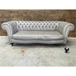 Three seat Chesterfield sofa, upholstered in grey buttoned leather - damaged leg