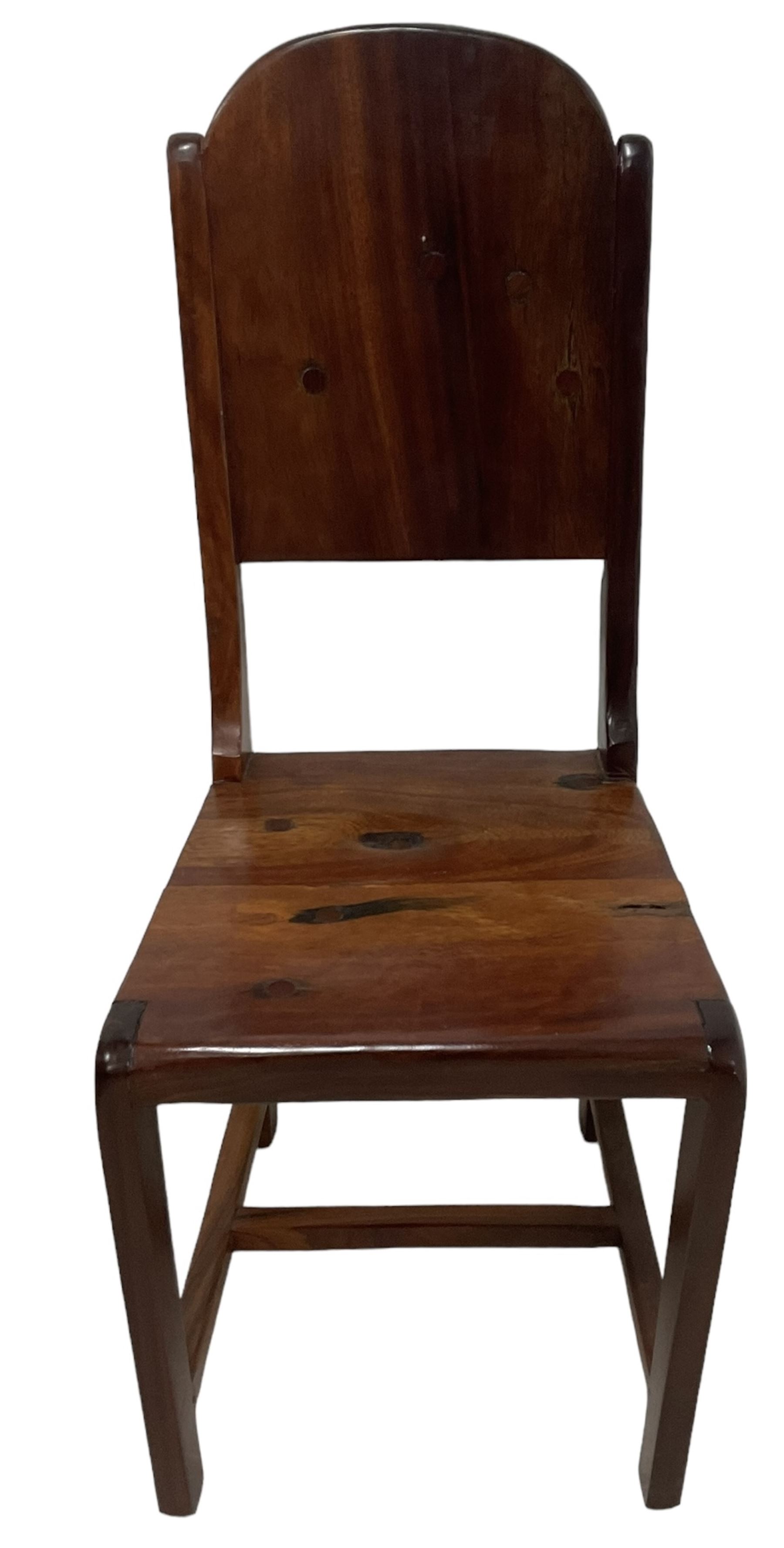 Mid-to-late 20th century teak dining table, rectangular top with canted corners, on square tapering supports with spade feet (214cm x 119cm, H76cm); and a set of eight Burmese reclaimed teak dining chairs, high arched back over panelled seat